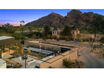 Stunning home with a backyard oasis including pool, patio area and mountain views in the background at 4900 E Arroyo Verde Dr, Paradise Valley, AZ 85253