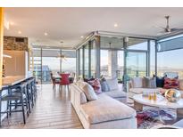 Bright and airy living room with floor-to-ceiling windows and modern furnishings at 7120 E Kierland Blvd # 1117, Scottsdale, AZ 85254