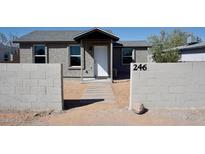 Charming exterior view of a single-story home featuring block wall and tidy landscaping at 246 E Central Ave, Coolidge, AZ 85128