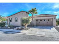 Charming home with a two-car garage, desert landscaping, and a beautiful, sunny blue sky at 27709 N 129Th Ln, Peoria, AZ 85383