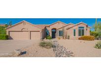 Charming single-story home featuring a desert landscaped yard, a two-car garage, and a welcoming entrance at 29399 N 67Th Way, Scottsdale, AZ 85266