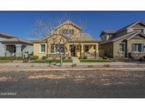 Charming two-story home with inviting front porch and manicured lawn at 4498 E Bethena St, Gilbert, AZ 85295