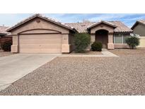 Charming single-story home with a two-car garage and well-kept desert landscaping at 60 W Shamrock St, Gilbert, AZ 85233