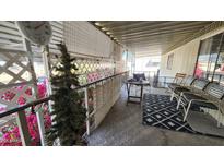 Inviting patio with cozy seating, decorative plants, and overhead cover providing a relaxing outdoor space at 11411 N 91St Ave # 48, Peoria, AZ 85345