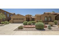 Charming single-story home with desert landscaping, a two-car garage, and a welcoming entryway at 15331 W Roma Ave, Goodyear, AZ 85395