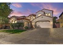 Stunning two-story home with a three-car garage and well-maintained landscaping, providing excellent curb appeal at 16018 W Shangri La Rd, Surprise, AZ 85379