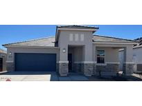 Beautiful single-story home with neutral colors, a two-car garage, and appealing desert landscaping at 25449 W Graham Trl, Buckeye, AZ 85326