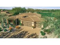 Stunning home exterior showcasing a clay tile roof, stone accents, and desert landscaping at 7920 E Greythorn Dr, Gold Canyon, AZ 85118