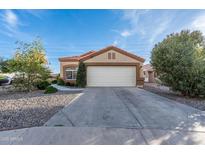 Charming single-story home with a well-maintained front yard, desert landscaping, and attached two car garage at 11955 W Granada Rd, Avondale, AZ 85392