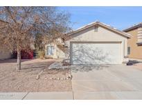 Charming single-story home with a two-car garage and low-maintenance desert landscaping at 12246 W Bloomfield Rd, El Mirage, AZ 85335