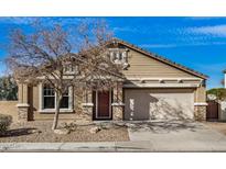 Charming single-Gathering home featuring a two-car garage and well-maintained landscaping at 17192 W Post Dr, Surprise, AZ 85388