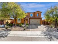 Charming two-story home featuring a two-car garage, well-maintained landscaping, and a beautiful brick driveway at 2463 E Stacey Rd, Gilbert, AZ 85298