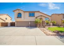 Beautiful two-story home featuring a spacious driveway and desert landscaping at 31487 N Blackfoot Dr, San Tan Valley, AZ 85143