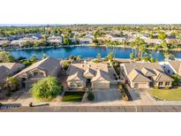 Stunning aerial view of lakeside homes, showcasing a serene waterfront community with lush landscaping at 844 W Beechnut Dr, Chandler, AZ 85248