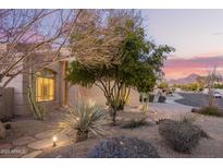 Charming front yard with desert landscaping, native plants and a walkway leading to the entrance at 9812 E Karen Dr, Scottsdale, AZ 85260