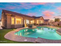 Inviting backyard pool and patio area perfect for outdoor entertaining, surrounded by lush landscaping at 10722 E Keats Ave, Mesa, AZ 85209