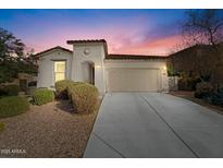 Charming single-story home with a two-car garage and well-maintained front yard landscaping at 11554 W Lone Tree Trl, Peoria, AZ 85383