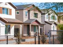 A row of newly built two-story homes, each with unique exterior color schemes and inviting front entrances at 482 S Soho Ln # 3, Chandler, AZ 85225