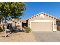 Charming home featuring a well-maintained front yard and a two-car garage at 6129 S White Pl, Chandler, AZ 85249