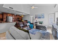Inviting living room featuring a leather sofa, plush seating, and an open layout to the kitchen at 9708 E Via Linda -- # 2328, Scottsdale, AZ 85258