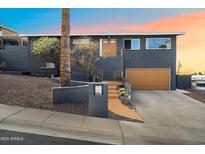 Stylish two-story home featuring a well-manicured front yard and a two-car garage at 1309 E Echo Ln, Phoenix, AZ 85020