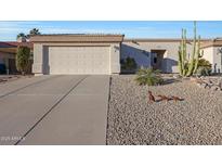 Charming single-story home featuring a two-car garage and desert landscaping at 16546 E Ashbrook Dr # A, Fountain Hills, AZ 85268