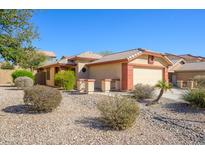 Charming single-story home with low-maintenance desert landscaping and a two-car garage at 23836 W Jefferson St, Buckeye, AZ 85396