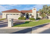 Charming single-story home featuring a red tile roof, well-manicured lawn, and inviting curb appeal at 2514 E Montebello Ave, Phoenix, AZ 85016