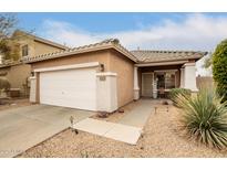 Charming single-story home with a two-car garage and well-maintained front yard at 40656 N Key Ln, Anthem, AZ 85086