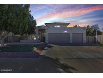 Charming two-story home with a three-car garage and desert landscaping at 5915 E Fairfield St, Mesa, AZ 85205