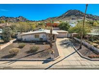 Charming home with a desert landscape, long driveway and mountain views at 9031 N 14Th St, Phoenix, AZ 85020