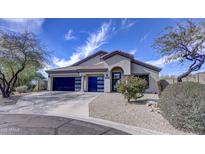 Charming home with a two-car garage and a beautiful desert landscape at 10262 E Jasmine Dr, Scottsdale, AZ 85255