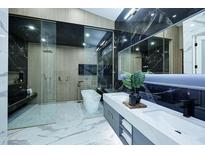 A spa-like bathroom with marble accents, a soaking tub, and sleek fixtures at 11578 N 80Th Pl, Scottsdale, AZ 85260