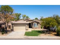 Charming single-story home featuring a well-maintained front yard and attached two-car garage at 16188 W Hearn Rd, Surprise, AZ 85379