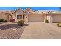 Inviting single-story home featuring a large driveway and desert landscaping at 7928 E Pueblo Ave # 56, Mesa, AZ 85208