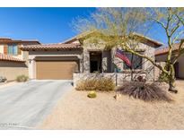 Charming single-story home with a desert-landscaped front yard and a two-car garage at 9260 E Greenway St, Mesa, AZ 85207