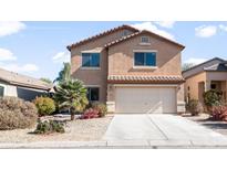 Charming two-story home with stucco siding, tile roof, and a well-maintained front yard at 28871 N Coal Ave, San Tan Valley, AZ 85143