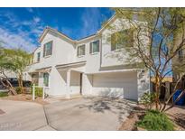 Charming two-story home with white exterior, attached two-car garage, and well maintained yard at 6451 N 17Th Pl, Phoenix, AZ 85016