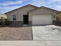 Charming single-story home featuring a two-car garage, low maintenance yard and a neutral color palette at 7321 N 123Rd Dr, Glendale, AZ 85307