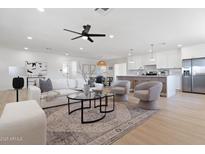 Bright living room features modern decor, plush seating, and seamless flow to the kitchen at 800 W Erie St, Chandler, AZ 85225