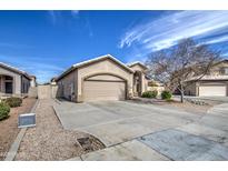 Charming home featuring a two-car garage and well-maintained landscaping at 9404 W Pierson St, Phoenix, AZ 85037