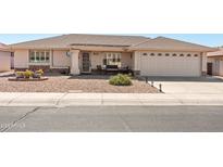 Charming single-story home features desert landscaping and a cozy front patio for relaxed outdoor living at 11413 E Neville Ave, Mesa, AZ 85209