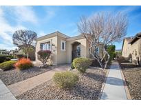 Charming home featuring a landscaped front yard with mature trees and a brick walkway at 12956 W Eagle Ridge Ln, Peoria, AZ 85383