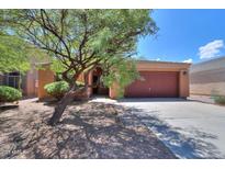 Front of single-story home with desert landscaping, driveway and two-car garage at 43573 W Blazen Trl, Maricopa, AZ 85138