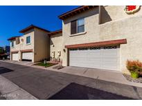 Condominium building showcasing attached garages and inviting front outdoor space at 5726 N 10Th St # 5, Phoenix, AZ 85014