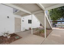 Building exterior showcasing concrete walkway, stairs, and unit door at 815 N Hayden Rd # B109, Scottsdale, AZ 85257