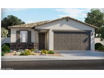 Charming single-story home showcasing a stone veneer accent and a two-car garage at 8506 W Trenton Ct, Florence, AZ 85132