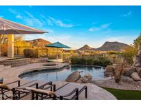 Beautiful pool and spa overlook amazing mountain views in backyard oasis at 12026 N 138Th St, Scottsdale, AZ 85259