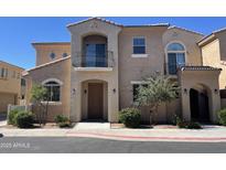 Charming two-story townhome with desert landscaping, balcony, and inviting front entrance at 1367 S Country Club Dr # 1315, Mesa, AZ 85210