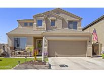 Two-story home boasts a front yard and a two-car garage, with a security camera at 17012 S 27Th Ln, Phoenix, AZ 85045